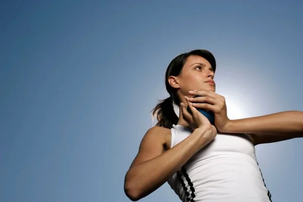 athlete throwing shot put